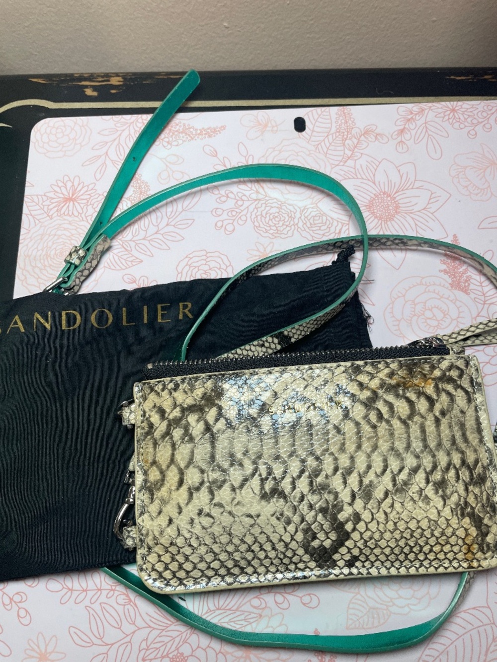 Bandolier crossbody phone case/wallet. Snakeskin with metallic green contrast.